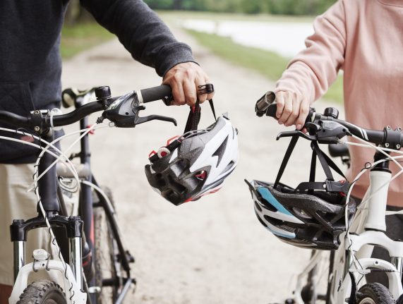 mature-couple-walking-along-rural-pathway-with-bic-2024-10-18-11-01-29-utc