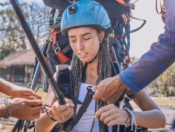 shot-of-people-preparing-woman-for-skydriving-in-b-2025-01-25-14-02-39-utc